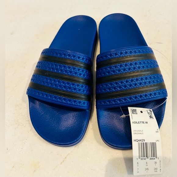 New with tags Adidas Adilette blue and black slides. Size 7 USA women’s - Picture 2 of 8